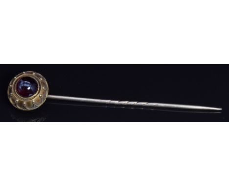 Victorian 15ct gold stick pin set with a garnet cabochon, 8.4cm long&nbsp;