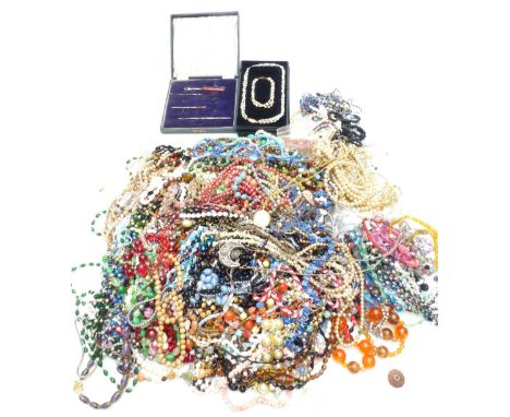 A collection of vintage beads including glass, mother-of-pearl, crystal etc