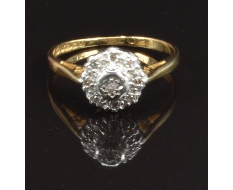 An 18ct gold ring set with diamonds in a platinum setting, size M, 2.8g