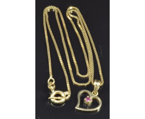 An 18ct gold pendant set with a ruby on an 18ct gold chain, 3g, length 44cm