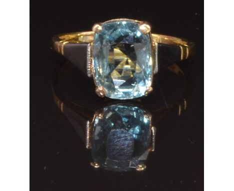 An 18ct gold ring set with a cushion cut aquamarine in a platinum setting, size N, 3.1g