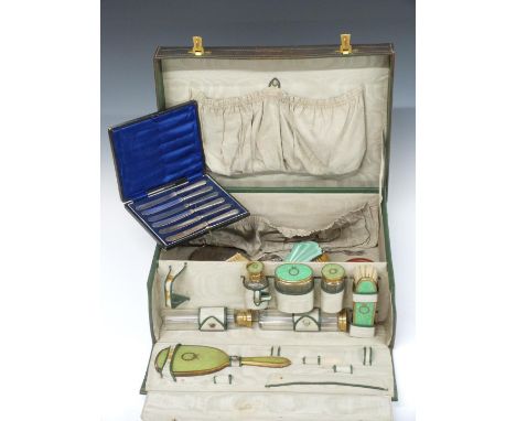 Green leather travelling vanity case with fitted interior and bottles, together with two guilloché enamel hallmarked silver b