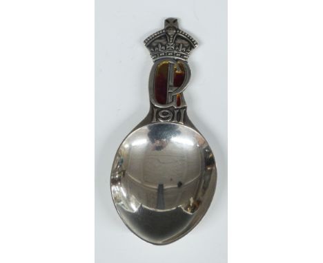 Liberty and Co 1911, George V Coronation hallmarked silver and red enamel caddy spoon, length 9.5cm, weight 24g