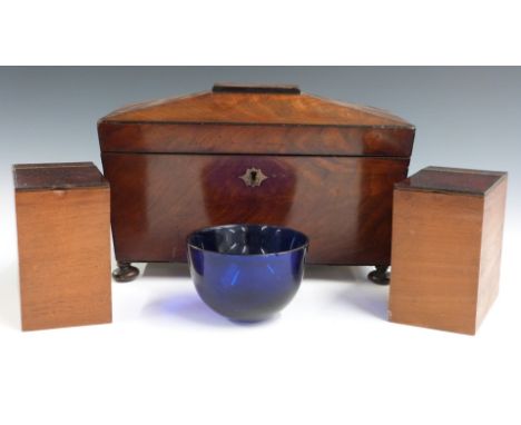 19thC flame mahogany sarcophagus shaped tea caddy with Bristol blue glass mixing bowl, raised on bun feet, W31 x D15 x H19cm