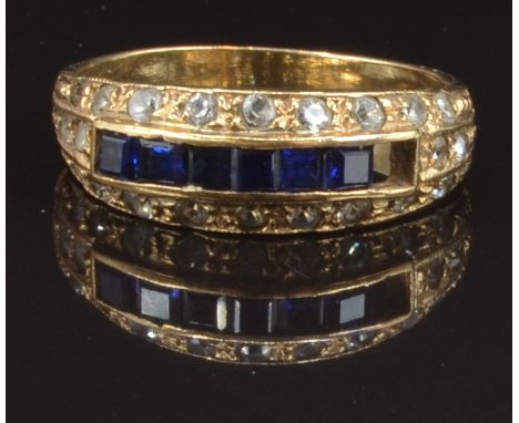 A 9ct gold ring set with square cut sapphires and paste, size O, 2.7g