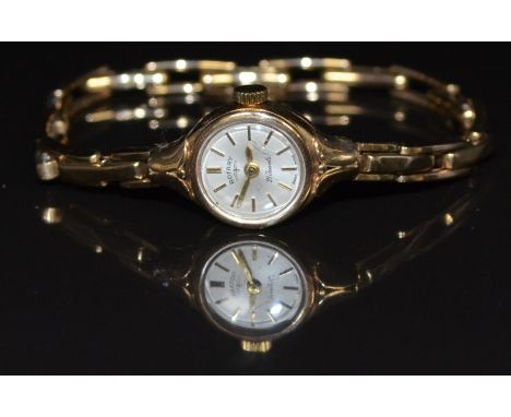 Rotary 9ct gold ladies wristwatch with gold hands and baton hour markers, silver dial and Swiss 21 jewel movement, on 9ct gol