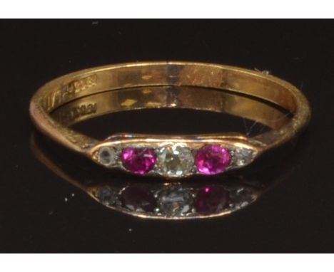 An early 20thC 18ct gold ring set with old cut diamonds and rubies, size R, 1.9g