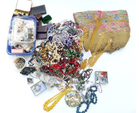 A collection of costume jewellery including vintage jewellery boxes, silver brooch, beaded necklaces, etc&nbsp;