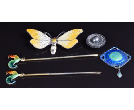 A hallmarked silver pendant set with green and blue enamel, a Victorian silver button, a silver butterfly brooch set with ena