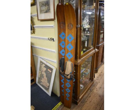A pair of vintage plywood water skis. 