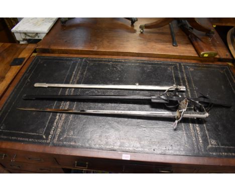 A George V infantry officer's sword and leather scabbard; together with a steel scabbard; and a pair of 2nd Lieutenant epaule