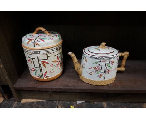 A Victorian Japonesque smear glazed pottery biscuit barrel and cover,&nbsp;18cm high; together with a similar teapot and cove