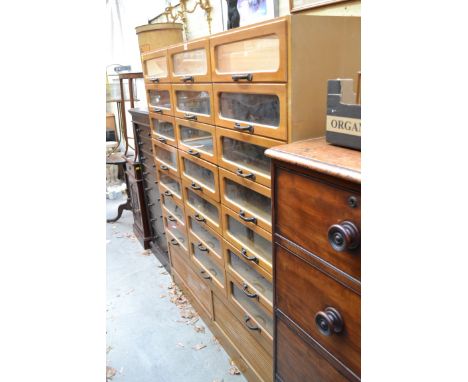 A vintage haberdashery chest,&nbsp;157cm high x 141cm wide, lacking top surface.&nbsp; 