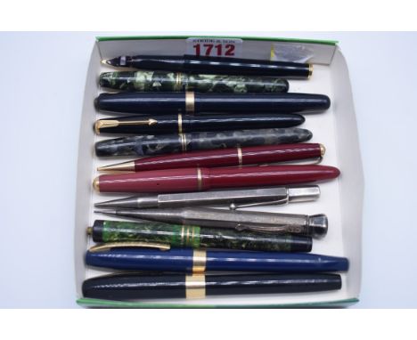 A small collection of vintage pens,&nbsp;to include four with 14ct nibs; another with Parker 18K nib, (lacking cap); a silver