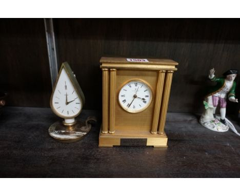 A vintage Swiza novelty chamberstick timepiece,&nbsp;13.5cm high; together with a Looping brass carriage timepiece. 