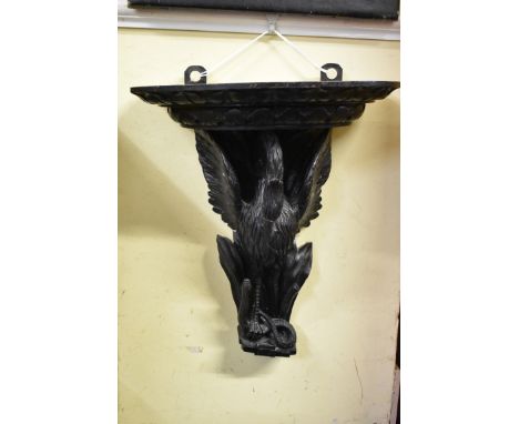 A late 19th century carved and stained oak 'Minories Eagle and Serpent' wall bracket,&nbsp;49 x 43cm.&nbsp; 