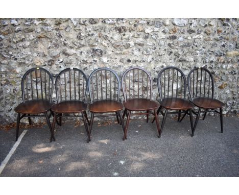 A set of six dark Ercol stick back dining chairs.&nbsp;This lot can only be collected on Saturday 10th October. (10-2pm) 