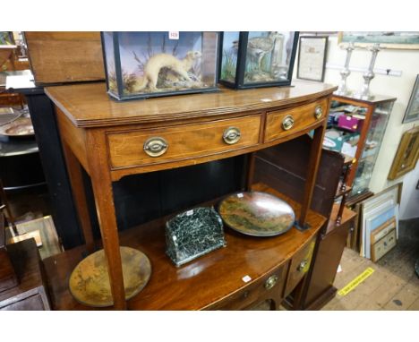 An early 19th century mahogany and line inlaid bow front side table,&nbsp;106.5cm wide.&nbsp; 