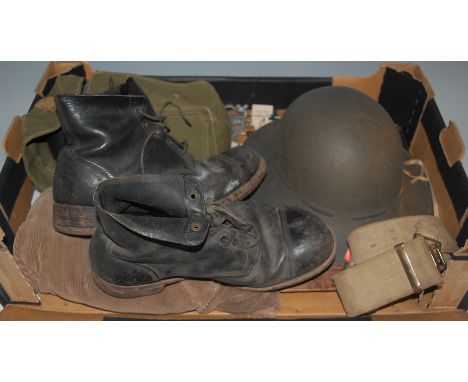 A WW II Brodie pattern steel helmet, stamped RO & CO 10/41 and dated 1941 to the leather liner, together with a webbing belt,