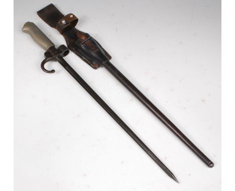 A French model 1886/35 Lebel bayonet, having a 34cm cruciform blade, hooked quillon stamped 63443 and nickel handle, in a ste