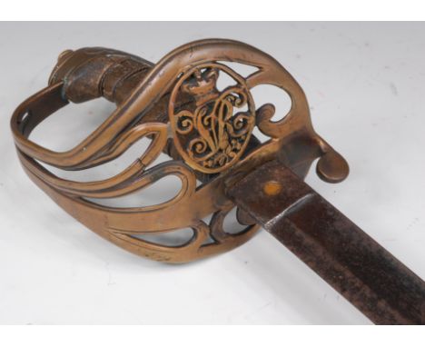 An 1854 pattern Infantry Officer's sword, having a 32cm etched steel blade, the pierced brass hilt with crowned VR cypher and