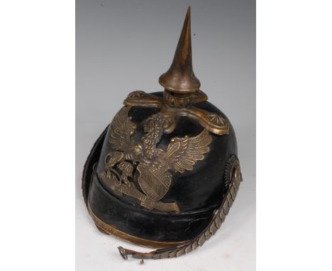 A Baden Infantry Officer's Pickelhaube, having a brass spike above Regimental badge and leather backed chin scales.