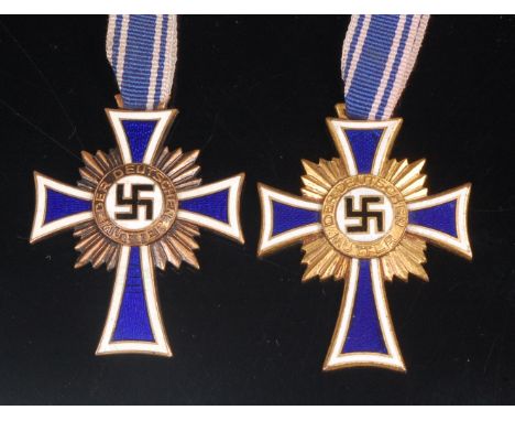 A Third Reich Cross of Honour of the German Mother in gilt, together with a bronze example. (2)