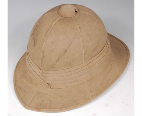 A WW II pith helmet with leather liner and chin strap, named to the liner F/LT S.J. Welton.

140681 Flight Lieutenant S.J. We