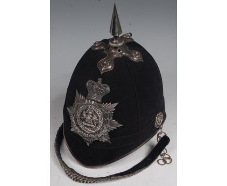 An 1878 pattern blue cloth Officer's helmet for the Manchester Regiment, 3rd Volunteer Battalion, circa 1888-1901, having sil