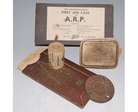 A pair of anti-gas Mk III eyeshields in original sleeve, together with The Householders' First Aid Case for A.R.P., a roll of
