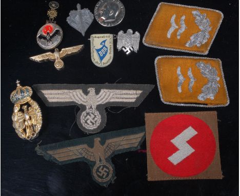 A collection of German cloth insignia to include Army Hoheitszeichen example, together with various tinnies etc. 