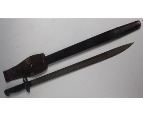 A British 1907 pattern Lee Enfield bayonet, the 43cm single edged fullered blade having crowned GR cypher 1907 Wilkinson with