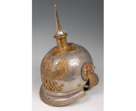 A Prussian Cuirassier trooper's steel helmet, having a brass spike plate with steel spike, lobster tail neck guard and brass 