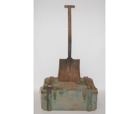 A WW II General Service shovel stamped Nash 1943 with broad arrow, together with a green painted ammunition trunk dated 1945.
