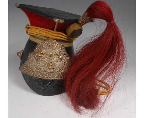 A Victorian 12th (Prince of Wale's Royal) Lancers Chapka black leather helmet, the leather covered square top with pleated re