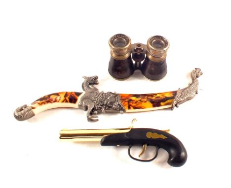 An ornamental dagger, pistol cigarette lighter and opera glasses