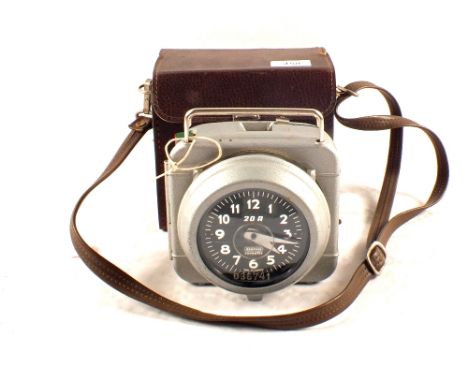 A cased pigeon time clock