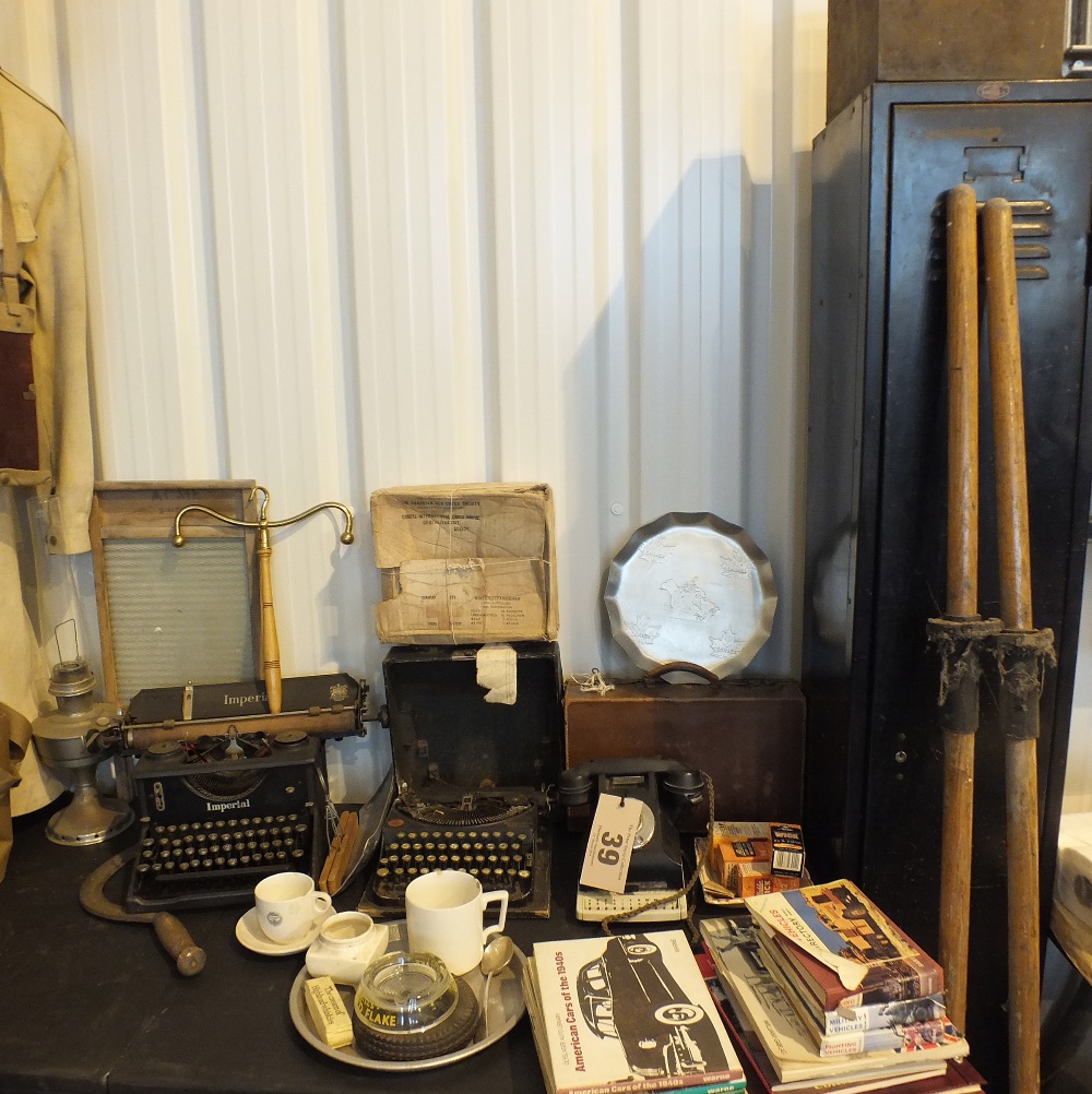 Lot 39 - A large group of vintage items including typewriters, Bakelite telephone, washboard and clothes hanger etc