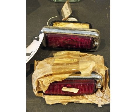 A pair of Lucas stop/tail lights with glass lenses