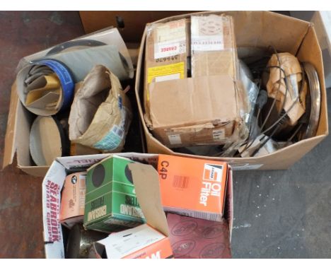 Three boxes of Ford parts, engine valves, wheel studs etc with oil filters