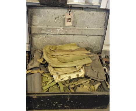 A large quantity of webbing within a military related tin trunk