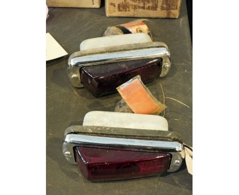 A pair of Lucas stop/tail lights with glass lenses