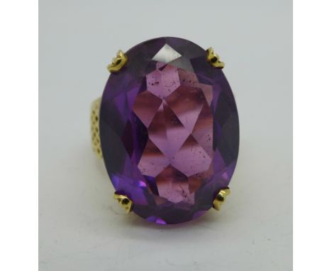 A 14ct gold and purple stone set ring, 11.5g, O, stone 20mm x 15mm