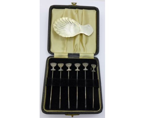 A silver caddy spoon and a cased set of six hallmarked silver cocktail sticks