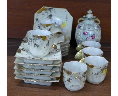 A Japanese six setting tea set comprising cups, square saucers and octagonal tea plates and an oriental lidded pot, pot a/f