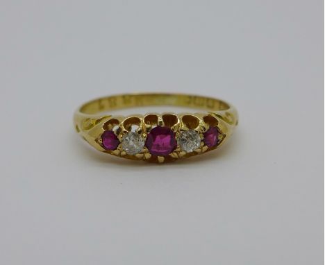 An 18ct gold, ruby and diamond five stone ring, 2.8g, M
