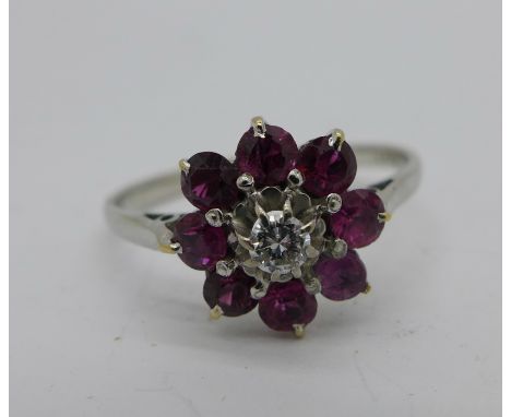 An 18ct gold, red stone and diamond ring, 3.3g, S