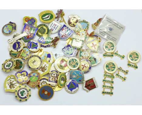 A collection of bowling club enamel badges