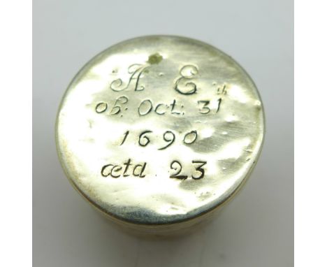 A white metal pill or patch box with inscription dated 1690