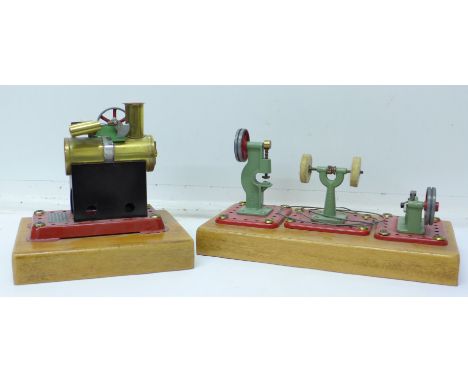A Mamod steam engine and three mounted workshop pieces